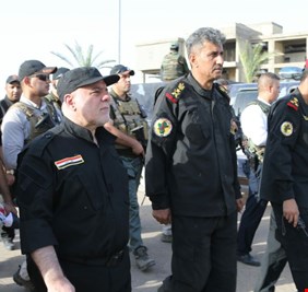 العبادي مخاطباً أهالي الموصل: سنقطع رأس داعش