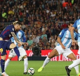 برشلونة يعبر فخ مالاجا في لقاء القمة والقاع