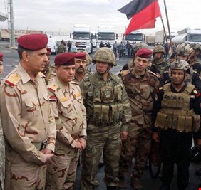 الغانمي يرفع العلم العراقي على معبر فيشخابور