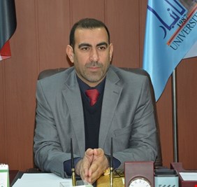 ما هو تبرير رئيس جامعة الانبار  لحادثة رفع صورة صدام في مقابلته مع وزير التعليم العالي ؟