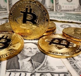 بيتكوين تتراجع وتهبط دون 60 ألف دولار