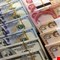 مخاوف شعبية في العراق من رفع سعر صرف الدولار مقابل الدينار